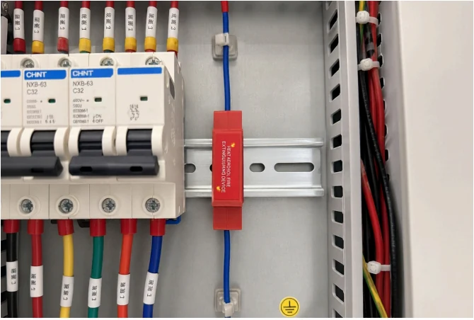 DIN rail mounted aerosol fire suppression device in an electrical panel